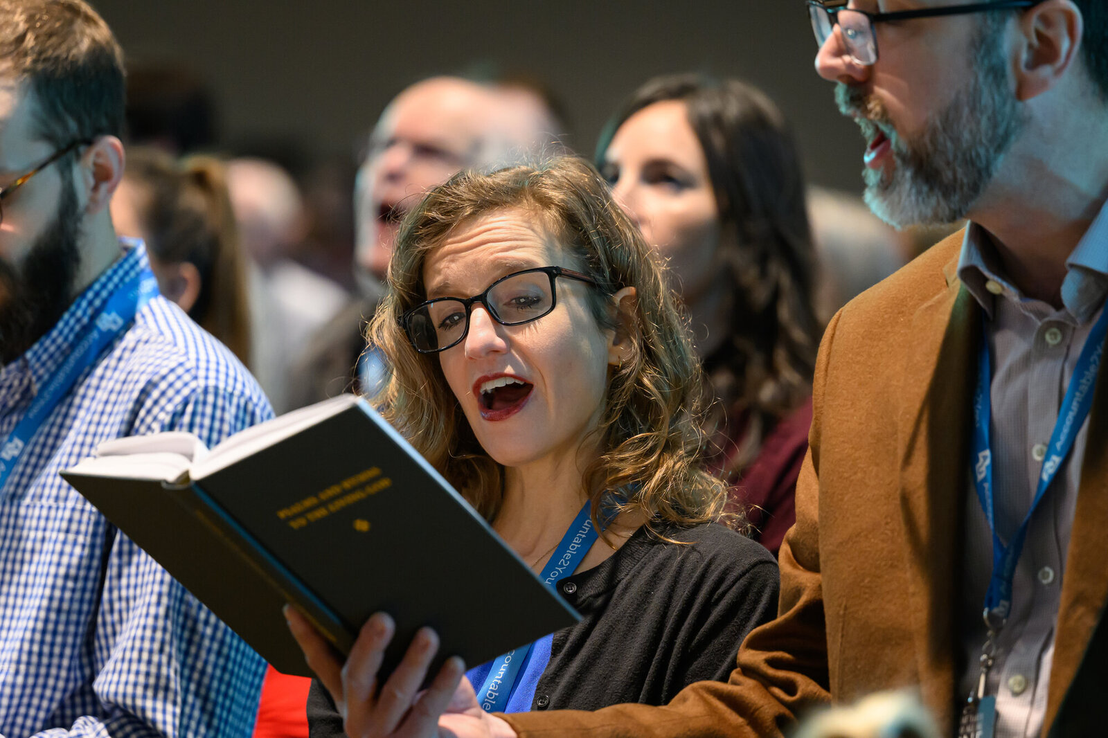 A worshiper sings from the Psalms and Hymns hymnal at Pray's Mill
